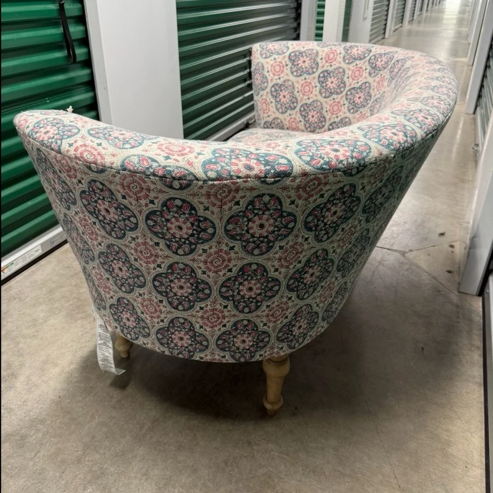 Elegant Patterned Sofa with Pink and Blue Accents